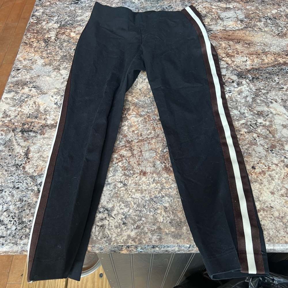 Black trousers with brown and white stripe